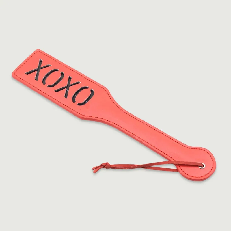 Paletă din piele artificială din seria Candy Spank cu decupaj XOXO - Coral — preț și oferte