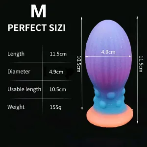 Plug anal din silicon de dimensiuni medii, care strălucește în întuneric, cu ventuză, 11,5 x 4,9 cm – Multicolor