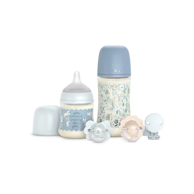 Set „Wonder Welcome Baby” – 2 biberoane, 2 suzete, 1 clemă pentru suzetă – albastru deschis — preț și oferte